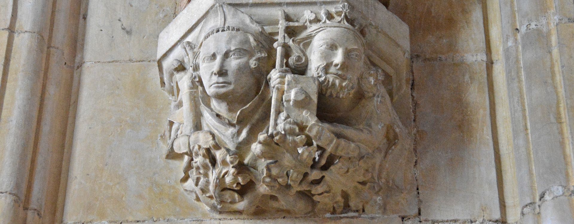 A stone carving of St John of Beverley and the Anglo-Saxon King Athelstan.