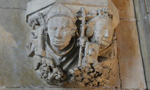 A stone carving showing the heads of St John of Beverley and King Athelstan.