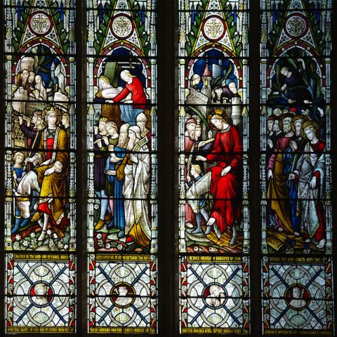 A view of one of the stained glass windows in the nave of Beverley Minster.