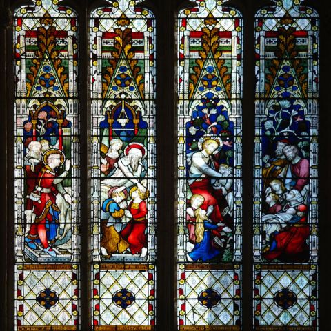 A view of one of the stained glass windows in the nave of Beverley Minster.
