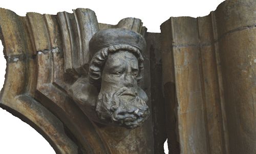 A 3D model of a bearded man carved in stone.