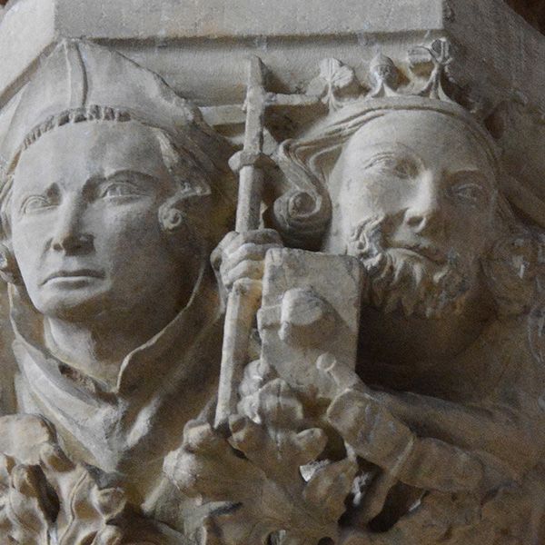 A stone carving showing St John of Beverley and King Athelstan next to each other.