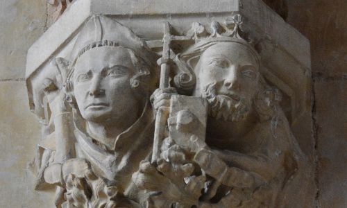 A stone carving showing St John of Beverley and King Athelstan next to each other.