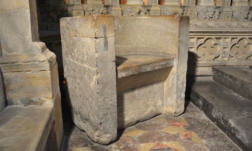 The stone 'Frith Stool' stands in a corner of the chancel at Beverley Minster.